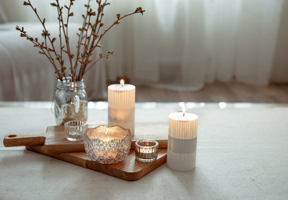 Close up of burning candles as a detail of home decor.